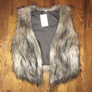 Faux fur vest !  NEVER USED !! TAG ATTACHED !